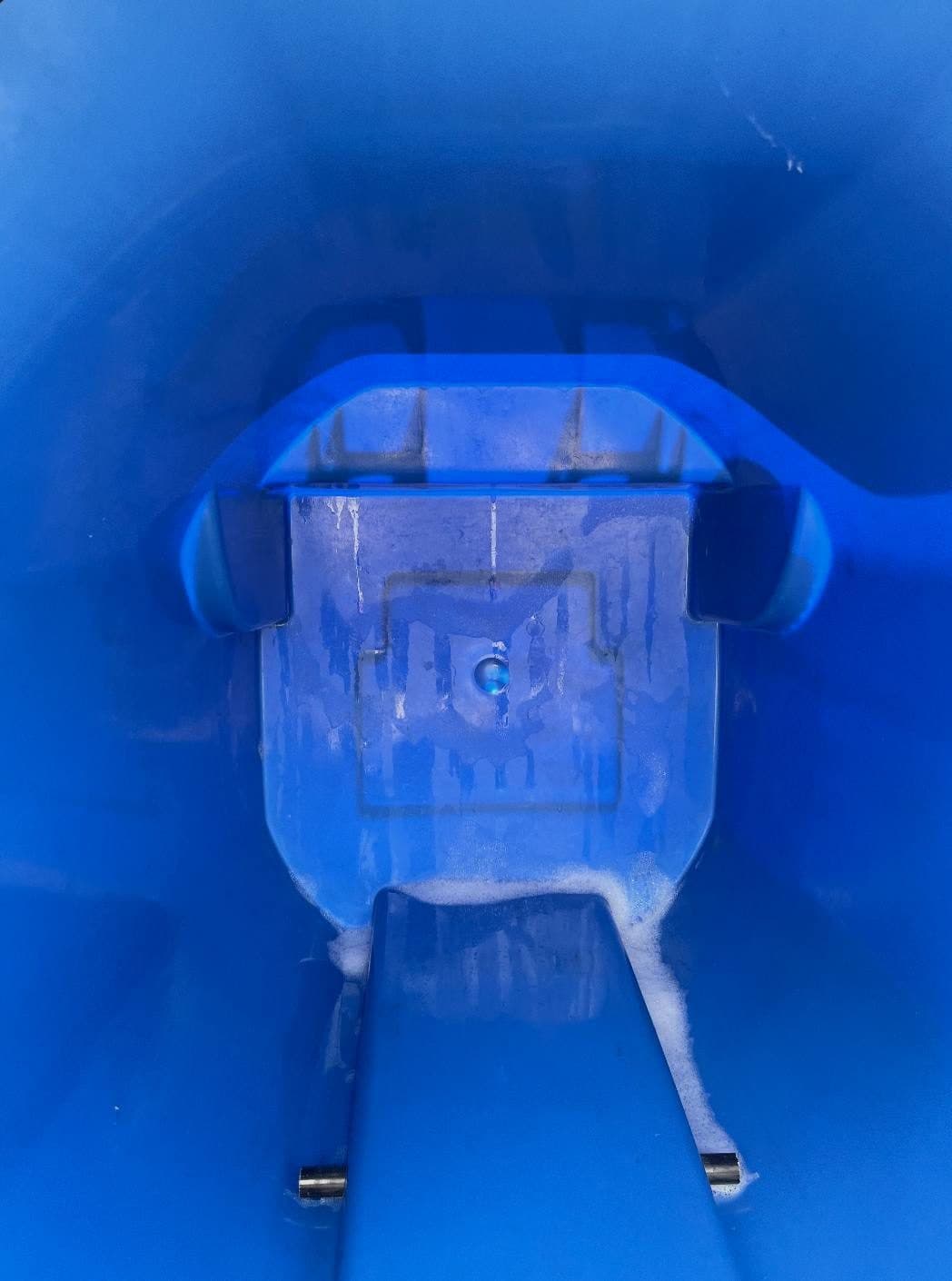 Inside of the same trash bin sparkling clean after our service